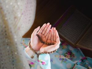 young muslim woman praying for Allah, muslim God